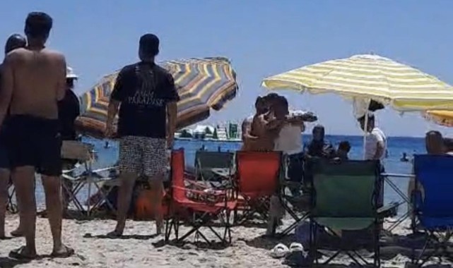Çeşme’de plajda ‘Şemsiyeni açamazsın’ kavgası